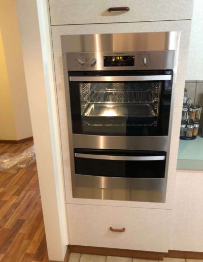 Old wall oven replaced with new stainless steel trims fitted as old oven larger than new - in a client's suburban Adelaide home