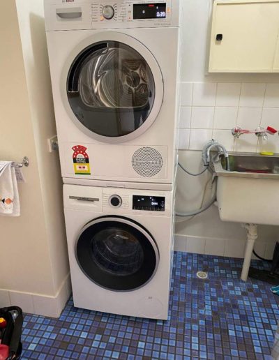 Bosch washer and dryer installed with stacker kit at Kensington