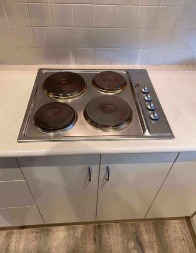 New cooktop replacement at Redwood Park old unit solid plates new unit ceramic glass top