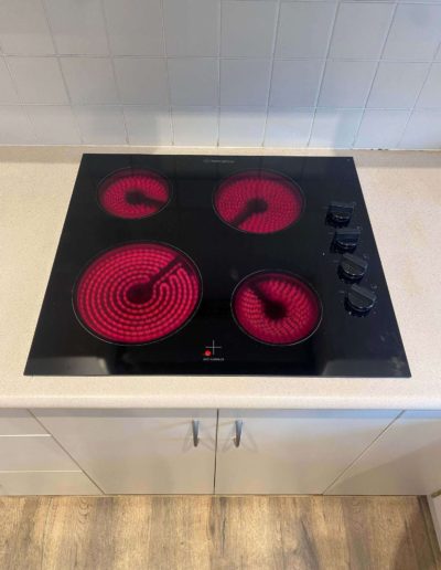 New cooktop replacement at Redwood Park old unit solid plates new unit ceramic glass top