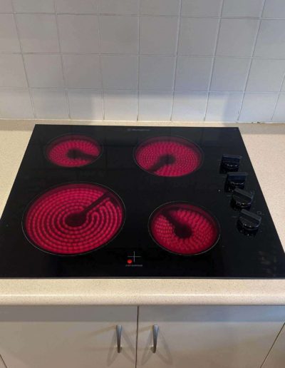 New cooktop replacement at Redwood Park old unit solid plates new unit ceramic glass top